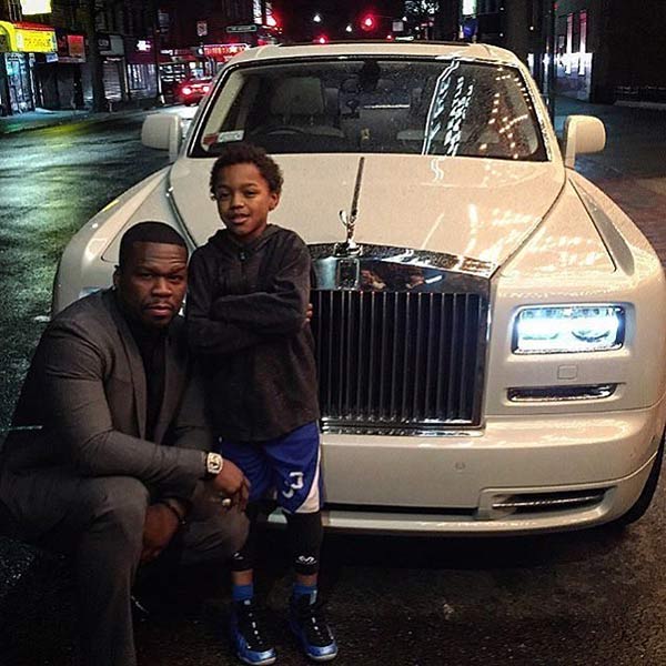 50 Cent with his car and kid