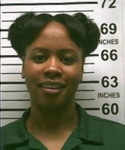 Remy Ma's mugshot from 2007 for attempted murder of a friend.