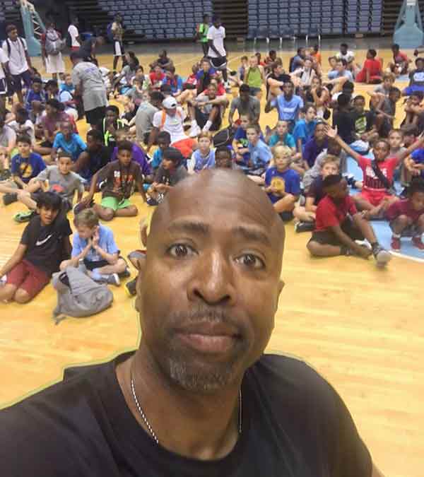 Kenny Smith clicking selfie with his basketball team mates